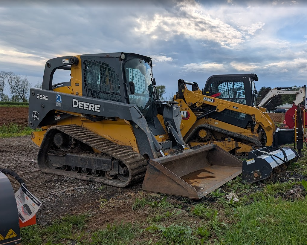 Rental equipment including John Deere and CAT compact track loaders at a Southeastern PA equipment rental business